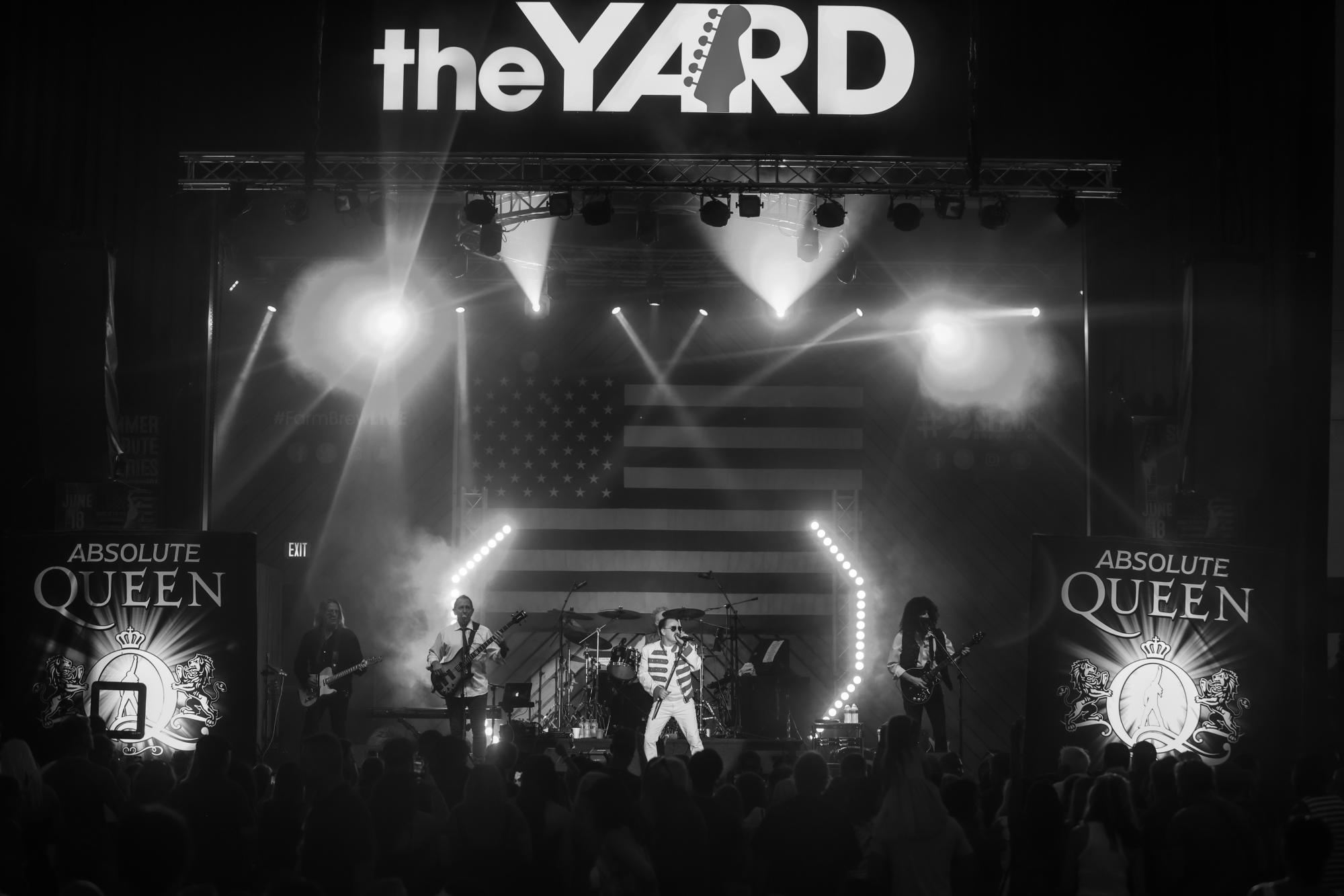 Queen cover band performs on stage at The Yard, the live music venue next door to 2 Silos in Manassas, VA
